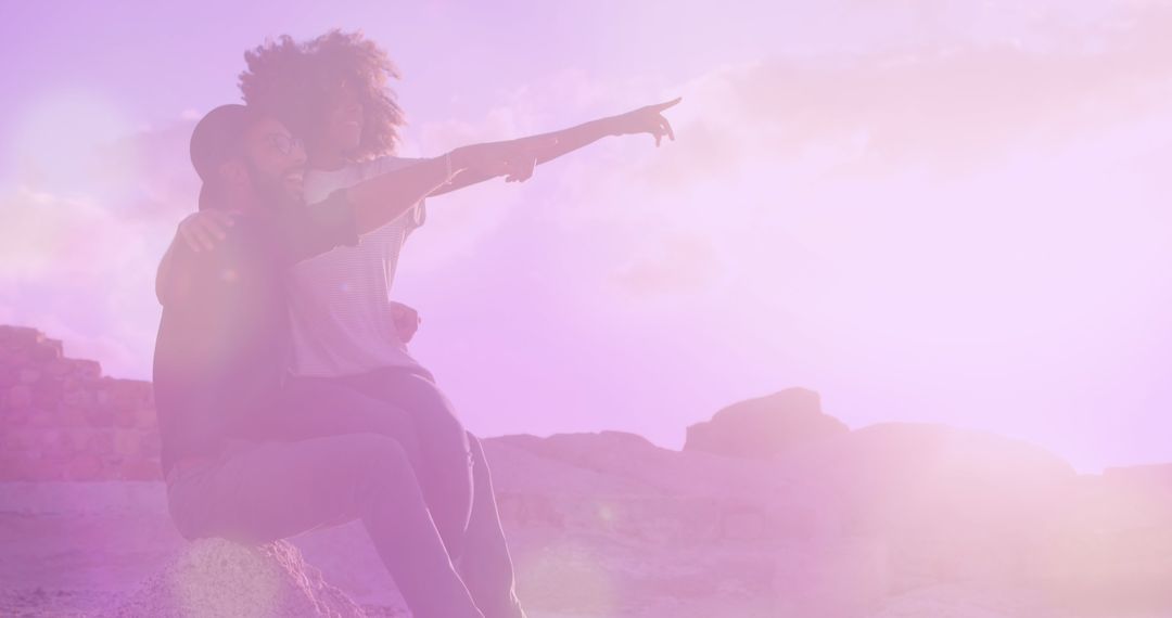 Happy Couple Enjoying Beach at Sunset with Light Effects