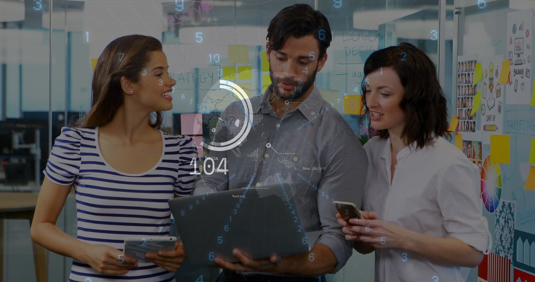 Team Analyzing Data with Futuristic Interface in Office