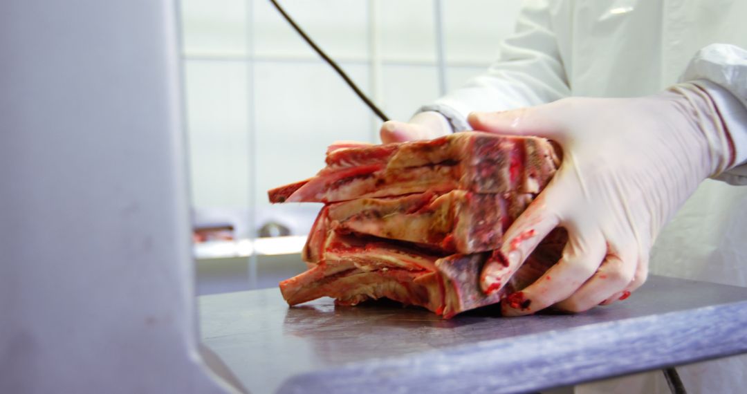 Butcher Handling Freshly Cut Meat on Worktop Surface - Free Images, Stock Photos and Pictures on Pikwizard.com