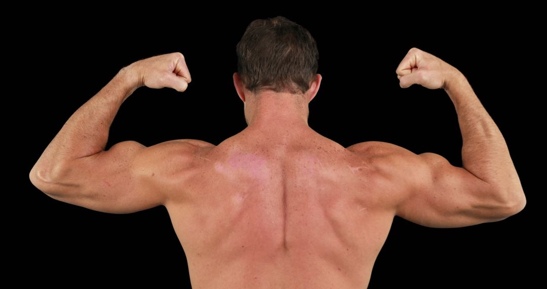 Muscular Man Flexing Strong Back and Biceps with Copy Space