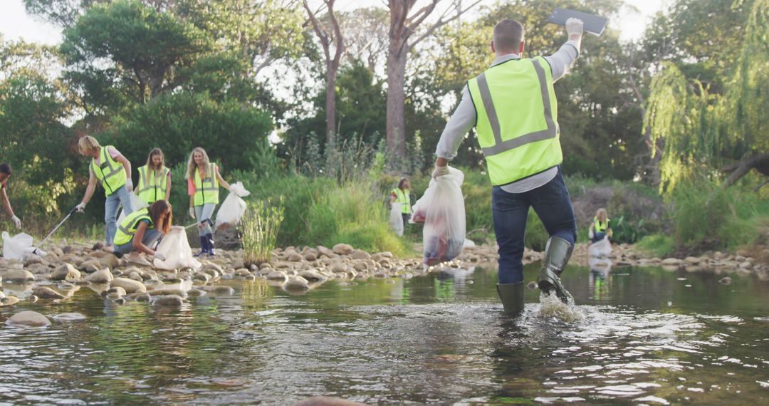 Dedicated Volunteers Cleaning River to Protect Environment - Free Images, Stock Photos and Pictures on Pikwizard.com