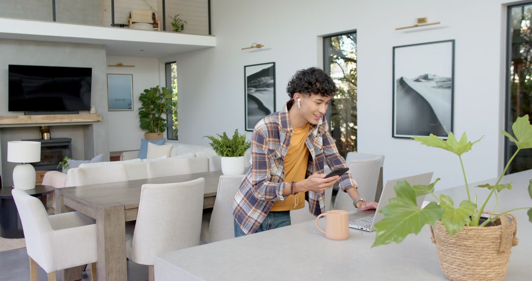 Man Engaging with Technology in Modern Living Space