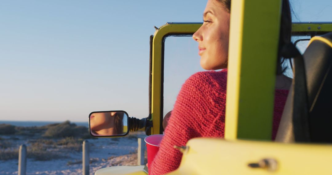 Woman Enjoying Scenic Beach View from Jeep at Sunset - Free Images, Stock Photos and Pictures on Pikwizard.com