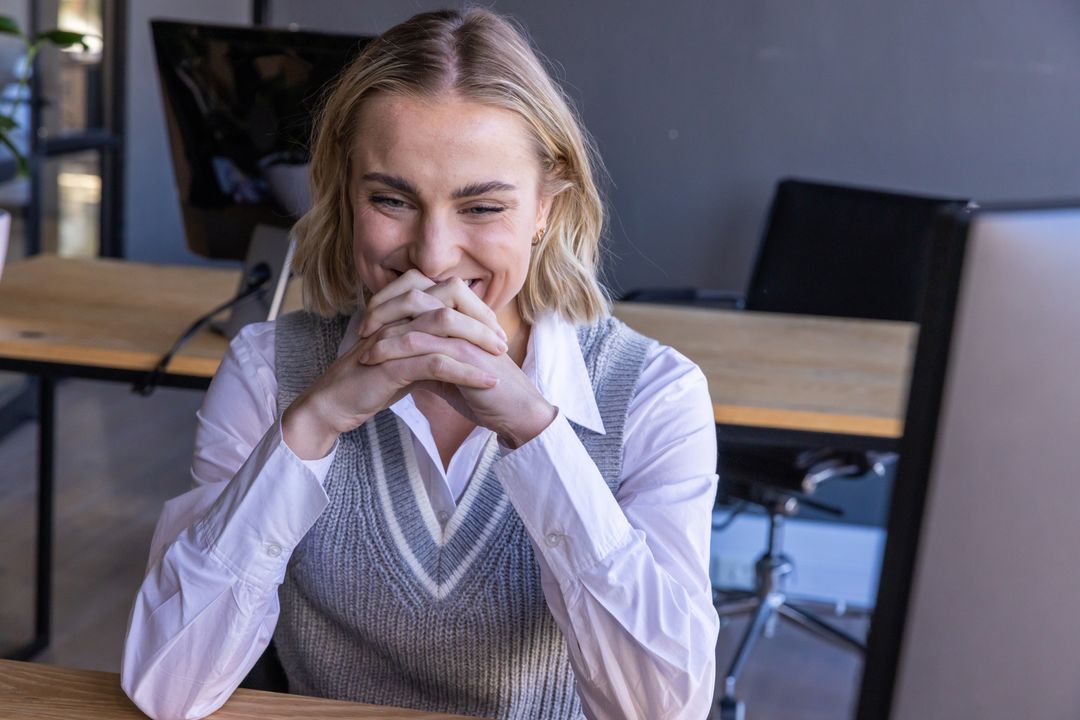 Smiling Businesswoman Enjoying Success in Modern Office Environment