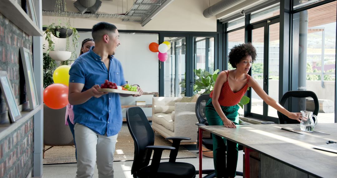 Office Staff Clearing After Party with Smiles and Laughter