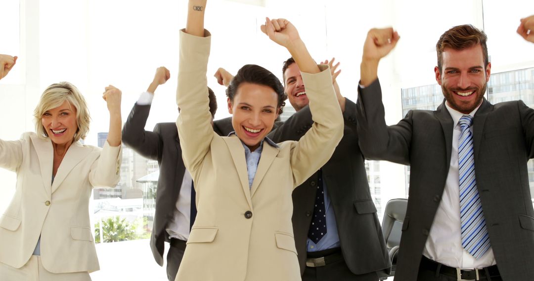 Successful Business Team Celebrating Achievement in Office - Free Images, Stock Photos and Pictures on Pikwizard.com