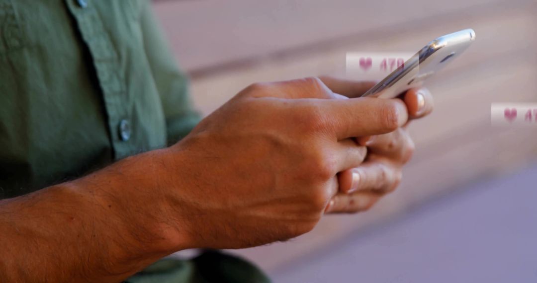 Man Typing Messages on Smartphone Outdoors