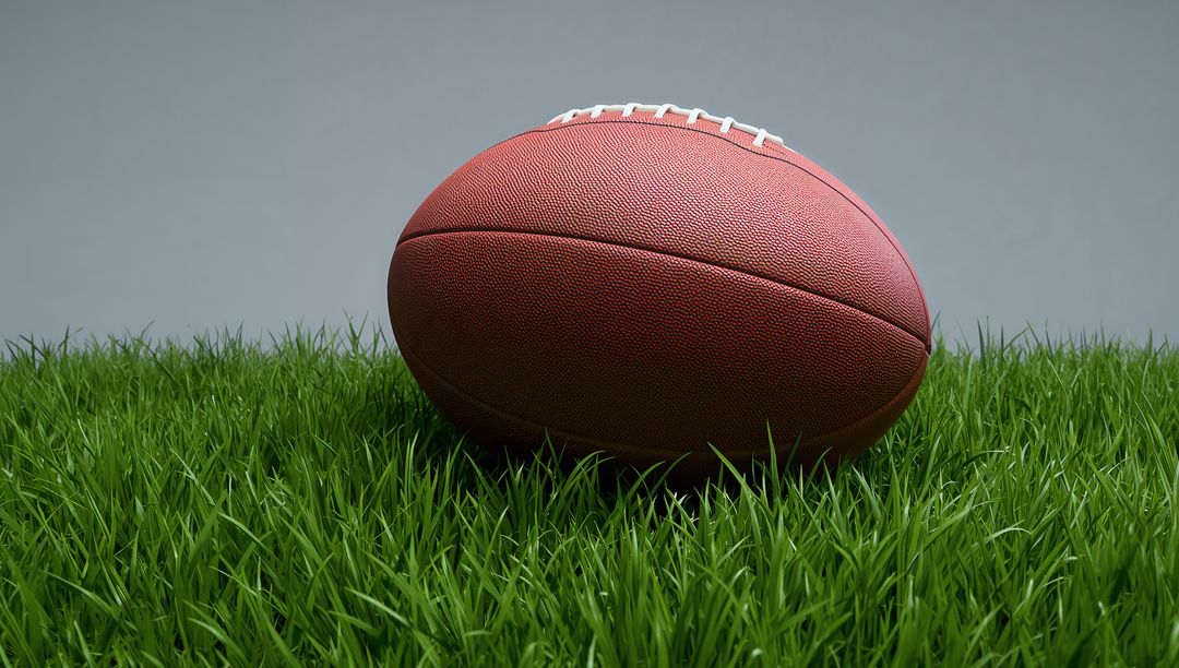 American Football on Grass with Subtle Backdrop