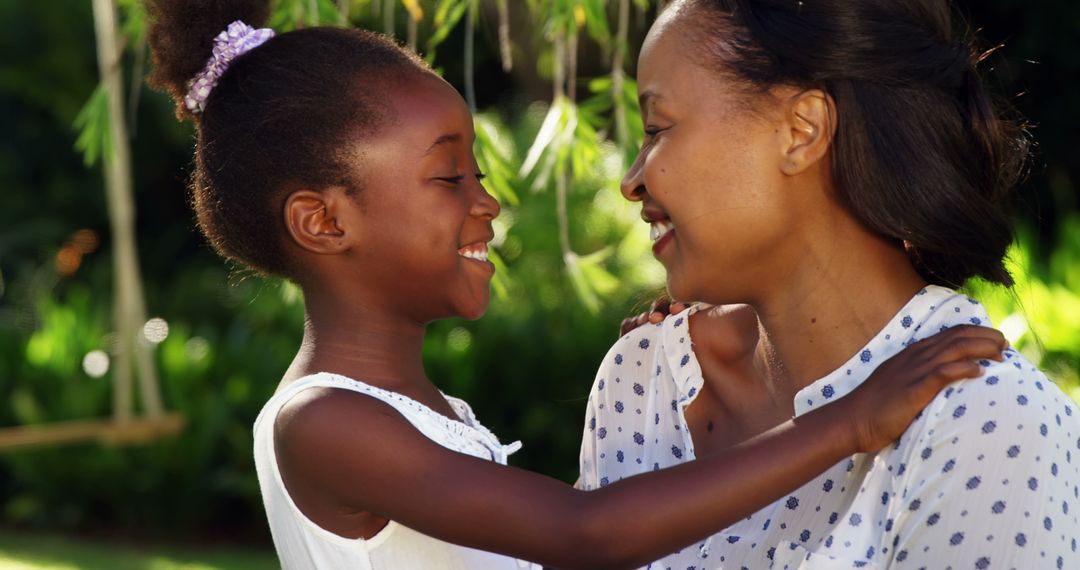 African American Mother and Daughter Sharing a Heartwarming Moment Outdoors - Free Images, Stock Photos and Pictures on Pikwizard.com