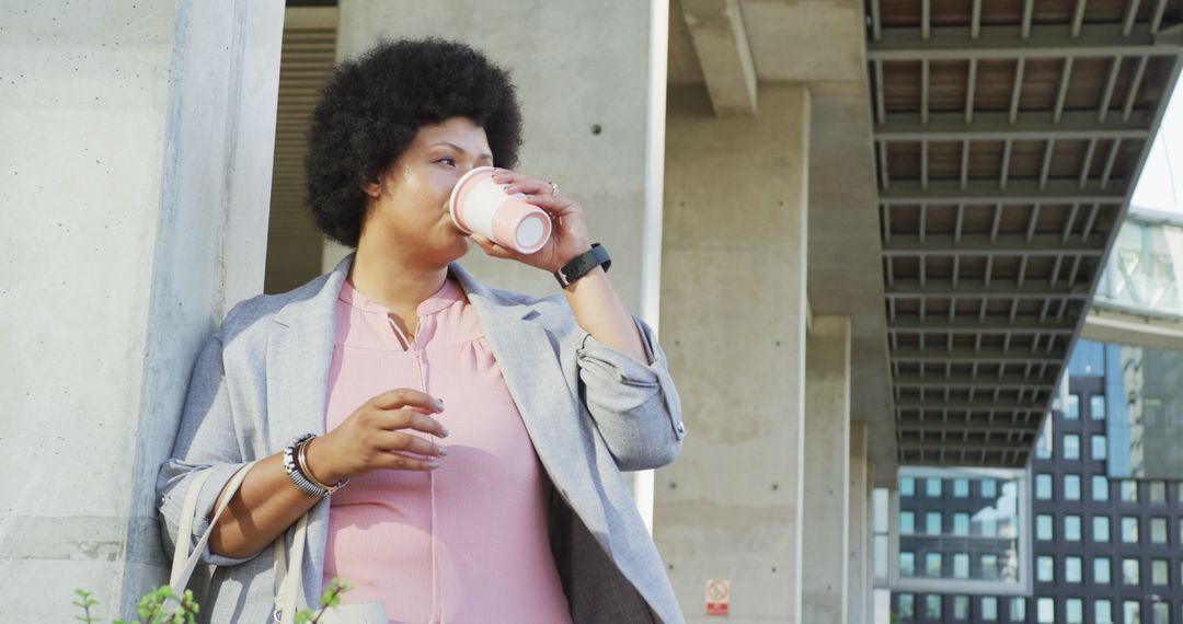 Stylish Plus Size Woman Enjoying Coffee in Urban Environment