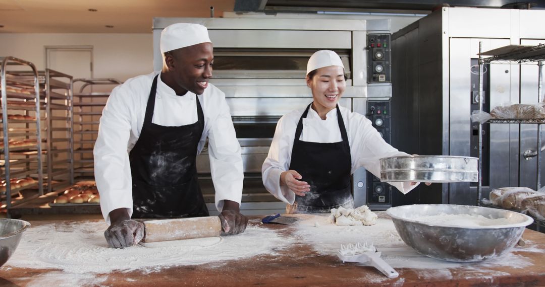 Two Bakers Working in Professional Bakery Kitchen - Free Images, Stock Photos and Pictures on Pikwizard.com