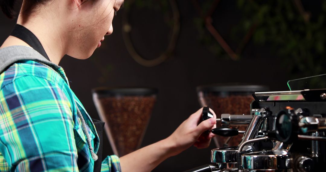 Skilled Barista Operating Espresso Machine in Cafe