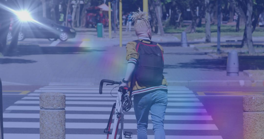 Albino Man with Bicycle Crossing Urban Street with Lens Flare