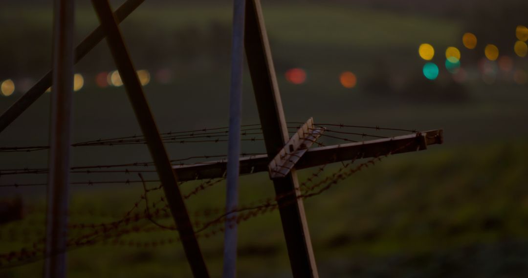 Night Landscape with Metal Fence and City Lights in Background - Free Images, Stock Photos and Pictures on Pikwizard.com