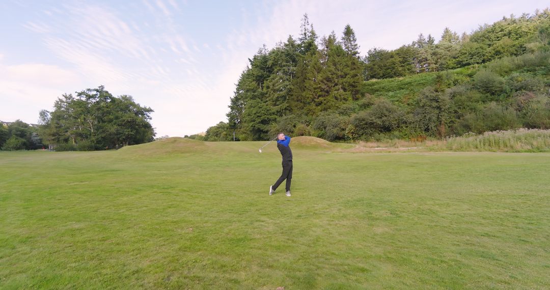 Golf Enthusiast Perfecting Swing on Idyllic Course