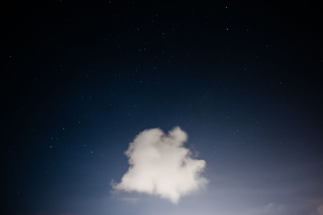 Lone cloud against starry night sky - Free Images, Stock Photos and Pictures on Pikwizard.com