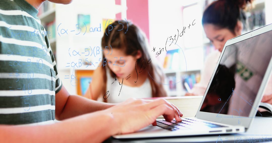 Students Using Laptop with Overlay of Mathematical Equations in Classroom