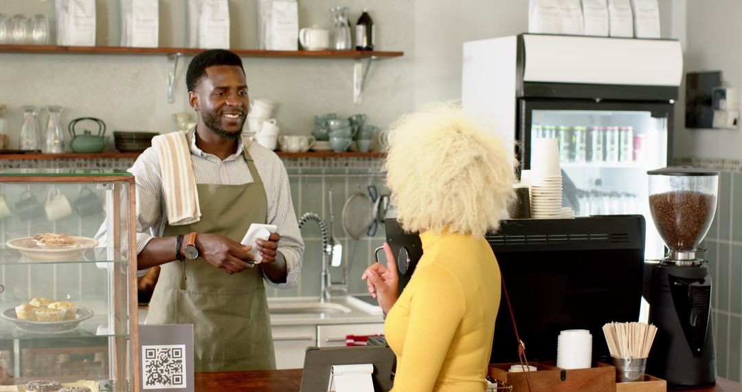 Friendly Barista Helping Customer in Cozy Café Atmosphere