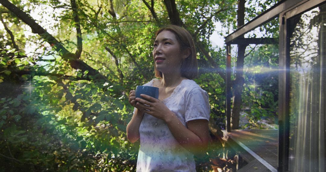 Asian Woman Enjoying Morning with Coffee in Forest