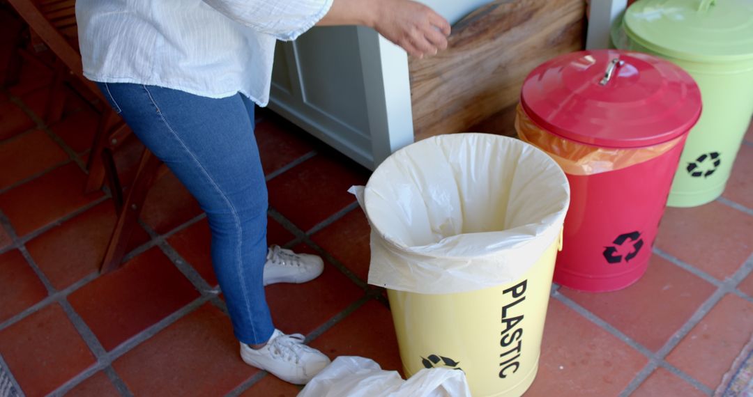 Senior Woman Organizing Waste for Recycling at Home