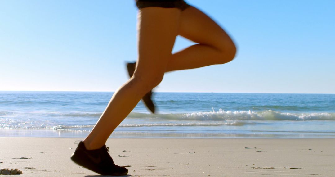 Woman Running on Beach on Sunny Day - Free Images, Stock Photos and Pictures on Pikwizard.com