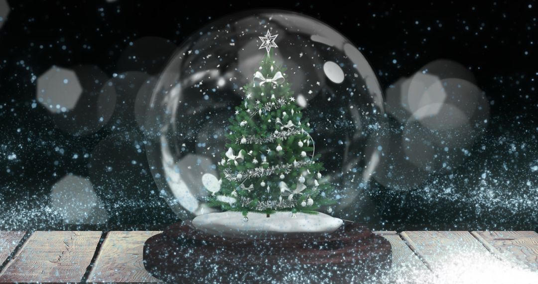 Christmas Snow Globe Featuring Sparkling Tree Amid Falling Snow - Free Images, Stock Photos and Pictures on Pikwizard.com