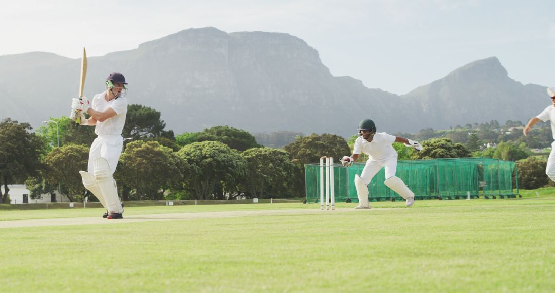 Cricketers Playing Match Outdoor Amidst Scenic Mountain Landscape - Free Images, Stock Photos and Pictures on Pikwizard.com