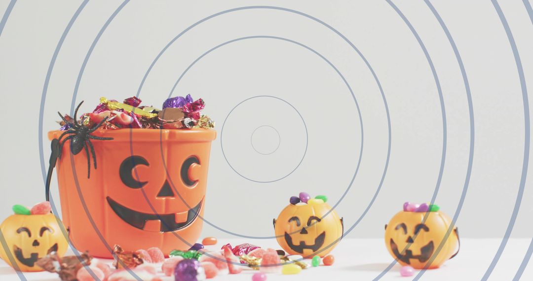 Jack-o'-lantern Candy Bucket Overflowing with Halloween Sweets and Mini Pumpkin Pails