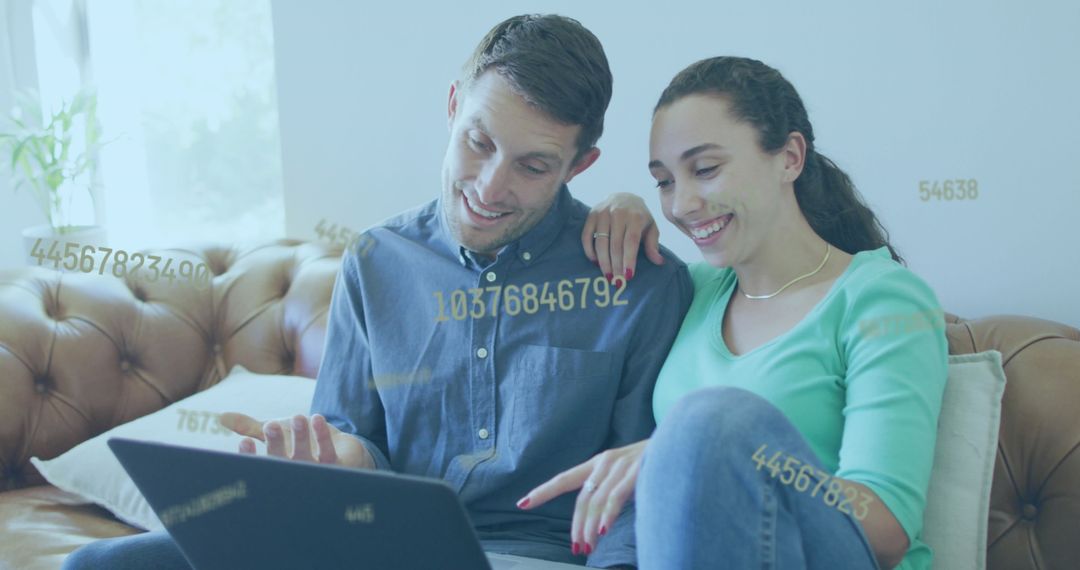 Couple Using Laptop with Digital Data Overlay