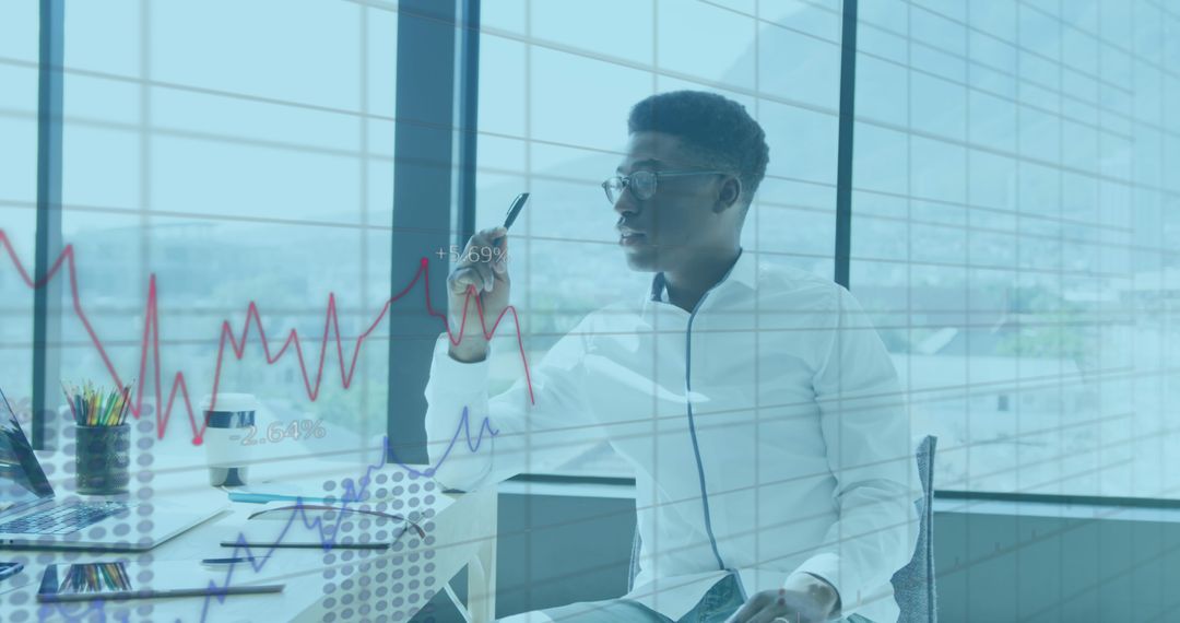 Business Executive Analyzing Financial Graphs in Modern Office