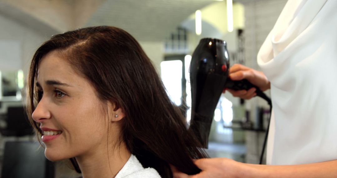 Woman Receiving Blow Dry at Hair Salon - Free Images, Stock Photos and Pictures on Pikwizard.com