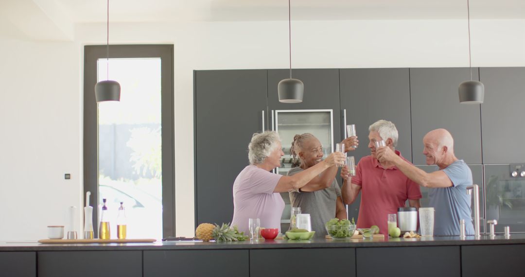 Group of Senior Friends Toasting in Modern Kitchen - Free Images, Stock Photos and Pictures on Pikwizard.com