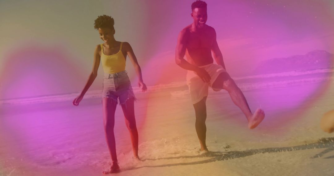 Sunny Beach Splashing Couple Embracing Joyful Moments