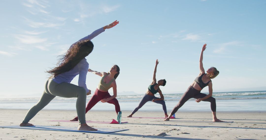 Group of Diverse Women Practicing Yoga on Beach at Sunrise - Free Images, Stock Photos and Pictures on Pikwizard.com