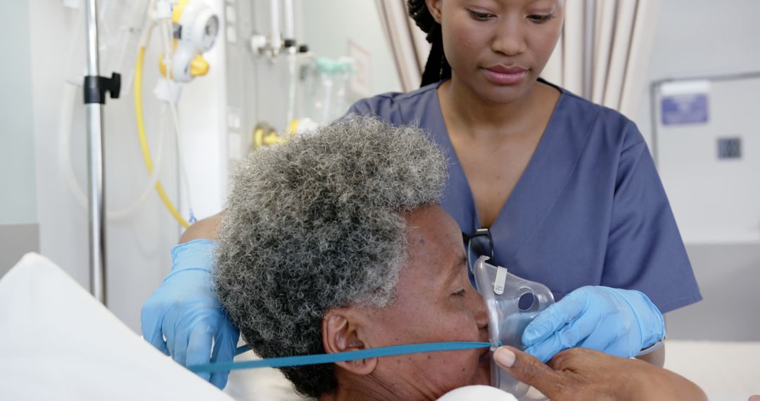 Nurse Assisting Elderly Patient with Oxygen Mask in Hospital - Free Images, Stock Photos and Pictures on Pikwizard.com