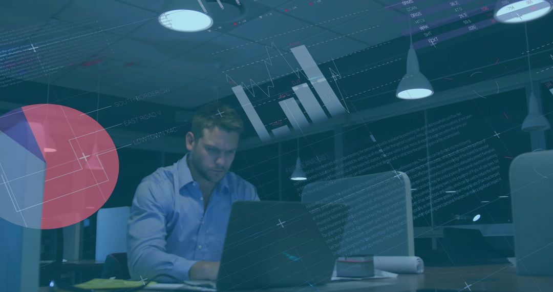 Businessman Analyzing Data on Laptop Late at Office