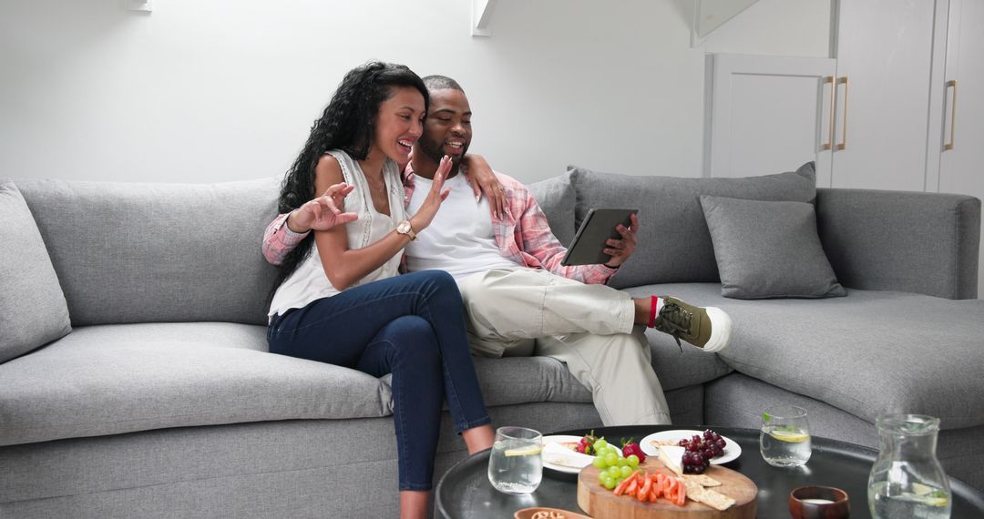 Couple Having Video Call Celebrating Engagement With Drinks