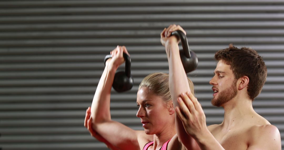 Fit Couple Lifting Kettlebells in Gym for Strength Training - Free Images, Stock Photos and Pictures on Pikwizard.com