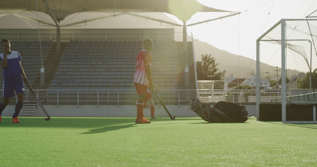 Field Hockey Players Practicing on Sunny Day - Free Images, Stock Photos and Pictures on Pikwizard.com