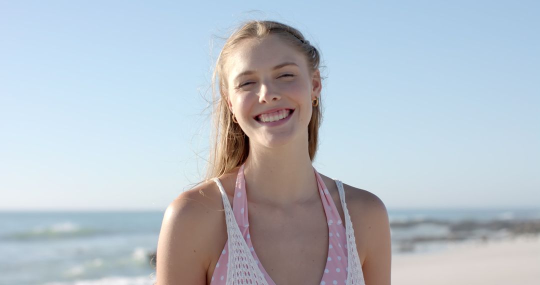Joyful Woman Smiling at Sunny Beach in Slow Motion