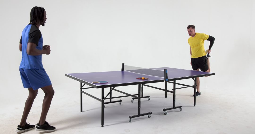 Dynamic Ping Pong Match Between Two Male Athletes