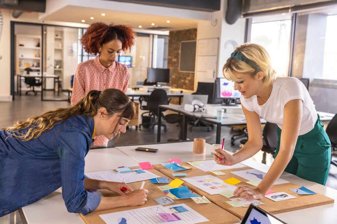 Diverse Coworkers Collaborating in Modern Office with Sticky Notes