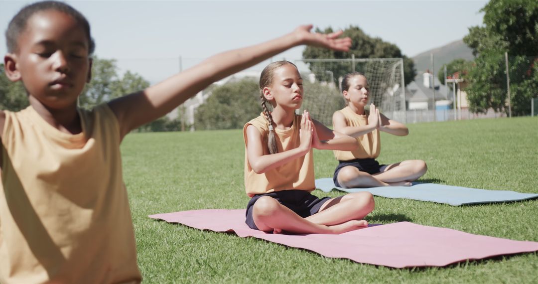 Group of Children Doing Yoga Outdoors on Sunny Day - Free Images, Stock Photos and Pictures on Pikwizard.com