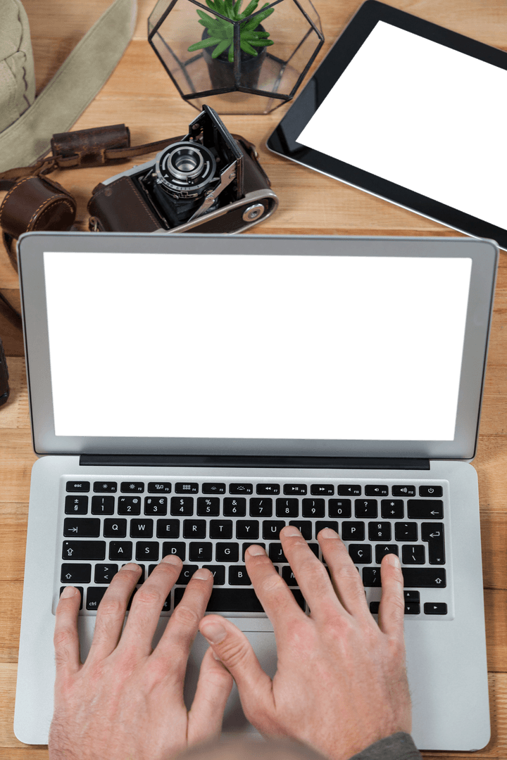 Transparent Laptop Screen with Photographer's Essentials on Wooden Desk