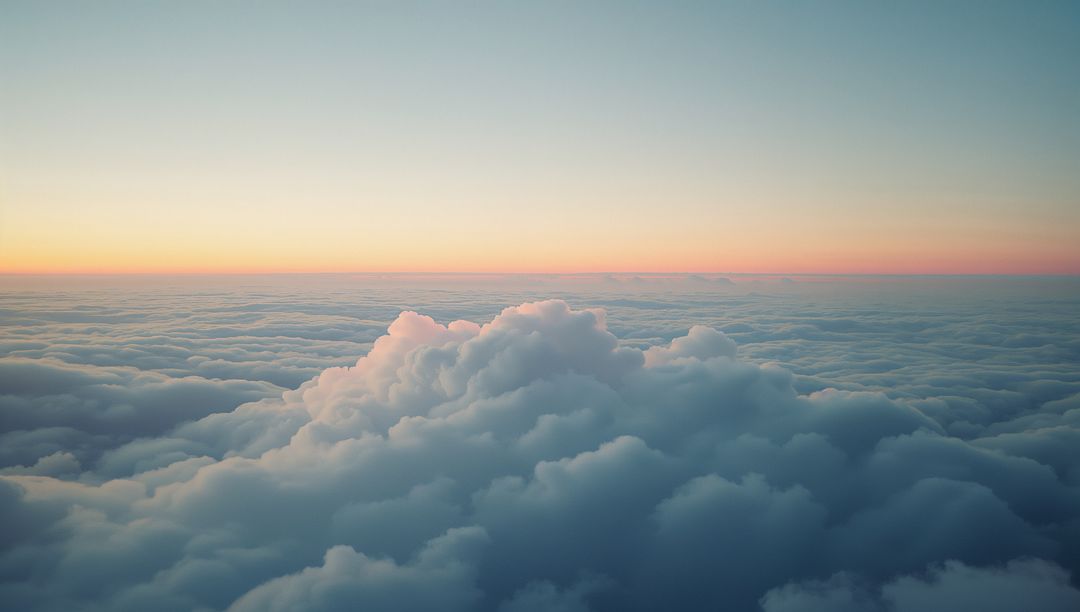 Ethereal Skyscape with Sunlit Clouds and Pastel Horizon