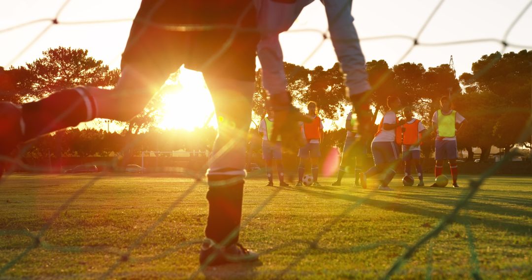 Children Playing Soccer at Sunset - Free Images, Stock Photos and Pictures on Pikwizard.com