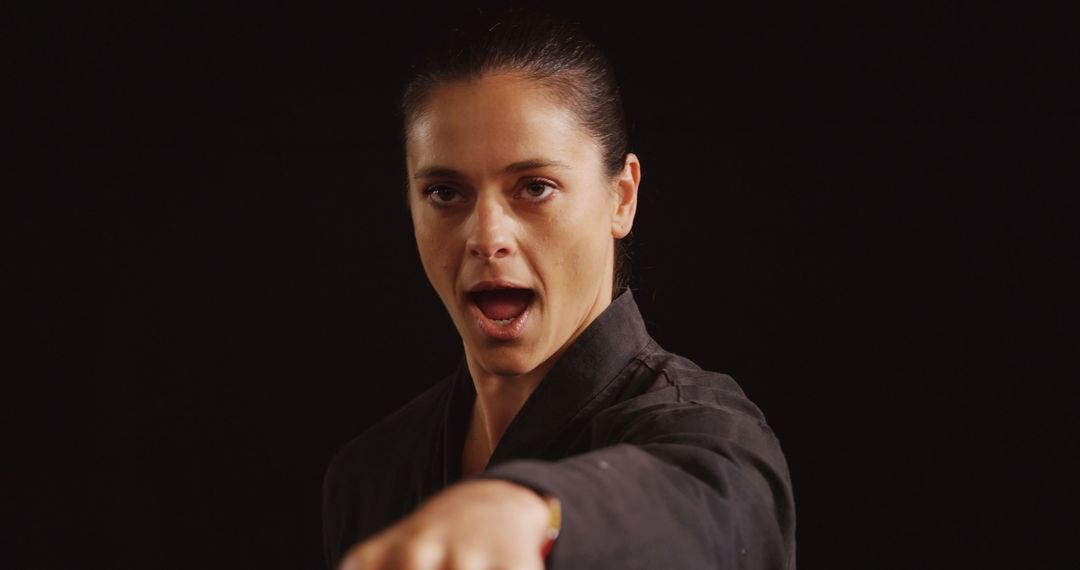 Female Martial Artist Practicing Karate Punch - Free Images, Stock Photos and Pictures on Pikwizard.com