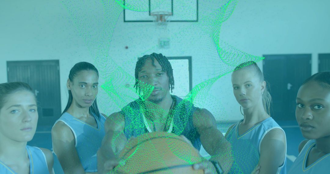 Posing mixed-gender basketball team showing unity and determination on indoor court