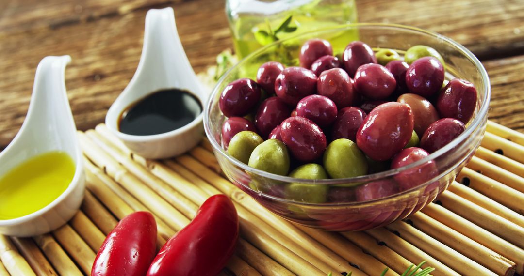 Assorted Fresh Olives with Dips on Rustic Wooden Table - Free Images, Stock Photos and Pictures on Pikwizard.com