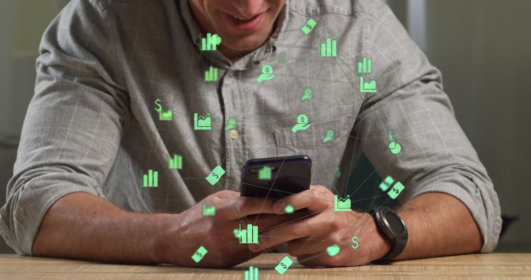 Man Using Smartphone with Financial Icons and Data Overlay - Free Images, Stock Photos and Pictures on Pikwizard.com